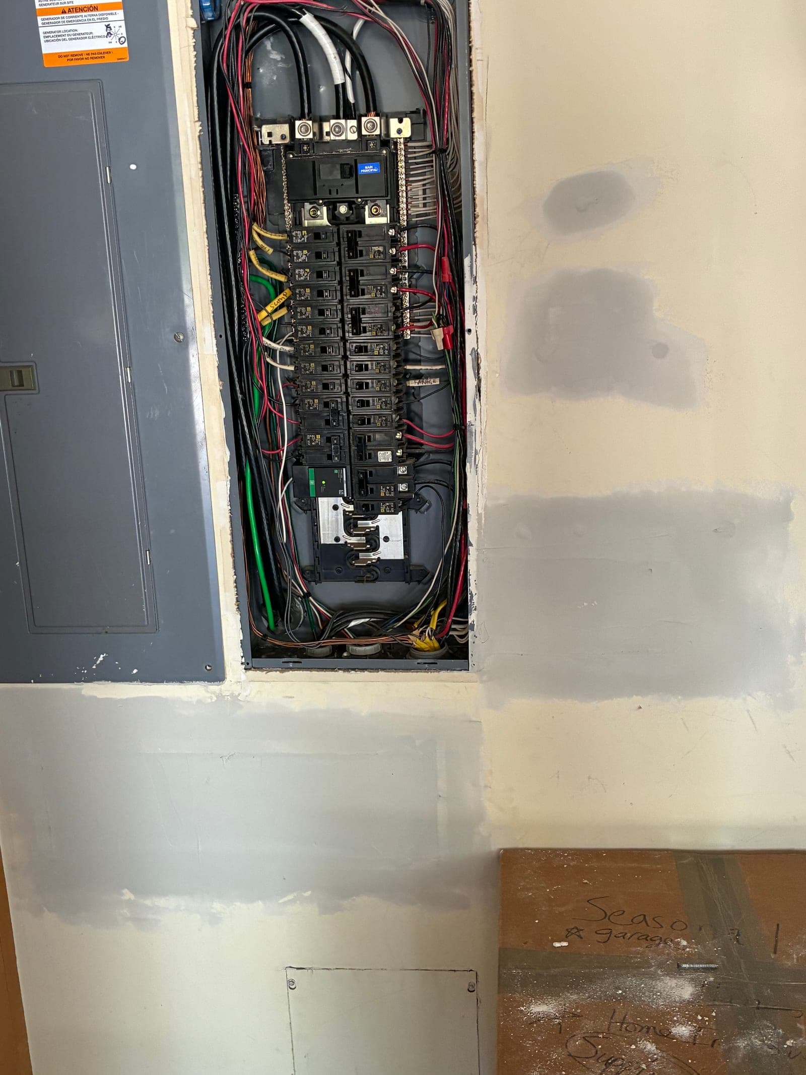 Same wall with the holes patched and mudded after repair